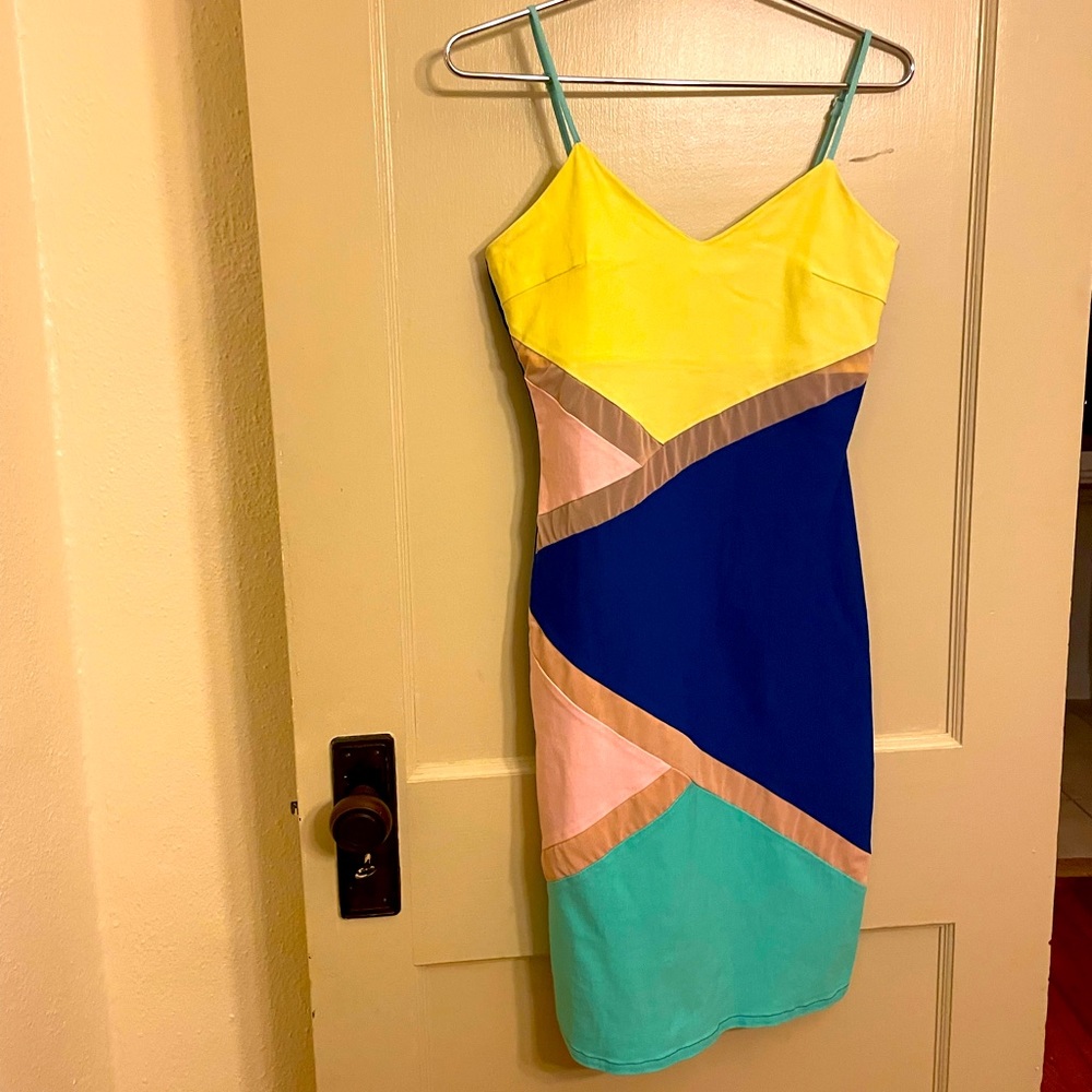 Fun, asymmetrical pattern, bright dress.